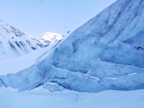 a large blue iceberg in front of a snow covered mountain at Chez Mamie Anna (B&B et Chalet) in Bessans