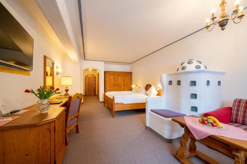 Postel nebo postele na pokoji v ubytování Hotel Trattlerhof