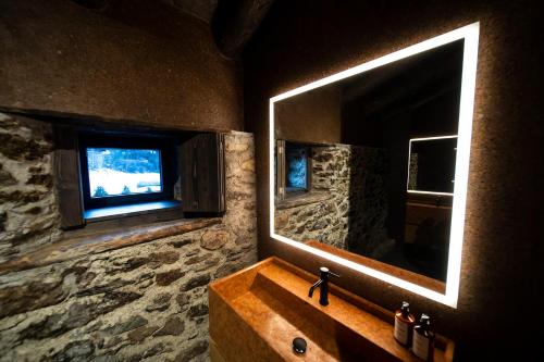  Les Pardines 1819 Mountain suites & SPA -  Room  picture :   Shower    Safety deposit box    TV                           