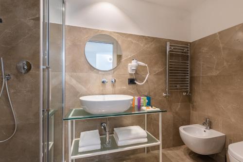 a bathroom with a sink and a shower at Mercure Roma Centro Termini in Rome