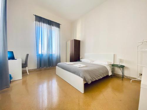 A bed or beds in a room at Mamamia #Politeama