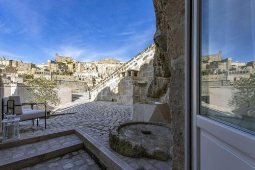 a view of a city from a window at Le Dimore Dell' Idris in Matera