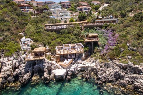 an aerial view of a resort on a rocky hill at Peninsula Gardens Hotel in Kas