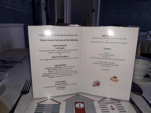 een menu voor een restaurant op een tafel bij Edendale House in Southport