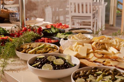 a table with many different types of food on it at Peninsula Gardens Hotel in Kas