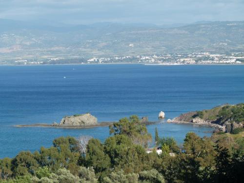 an island in the middle of a large body of water at Aphrodite Beach Hotel in Polis Chrysochous