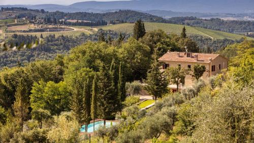 an image of a house in the hills with a swimming pool at TENUTA DI MACERICCA 10, Emma Villas in Poggibonsi