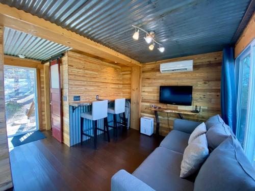 a living room with a couch and a table at Barefoot Hills in Dahlonega