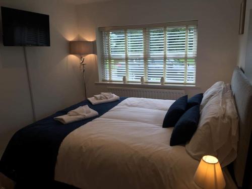 A bed or beds in a room at Dunsley Hall Country House Hotel 