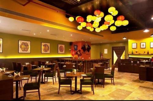 A restaurant or other place to eat at Hotel Mumbai House Airoli, Navi Mumbai
