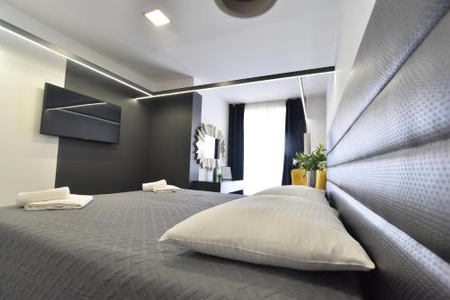 Postel nebo postele na pokoji v ubytování Mido Rooms