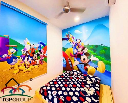 a bedroom with a mickey mouse mural on the wall at Legoland D'PRISTINE Apartment By TGP in Nusajaya