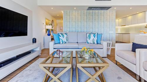 a living room with a couch and a table at Quinta do Lago Country Club in Quinta do Lago