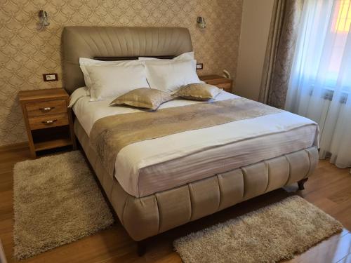 Postel nebo postele na pokoji v ubytování Apartmani Rajin