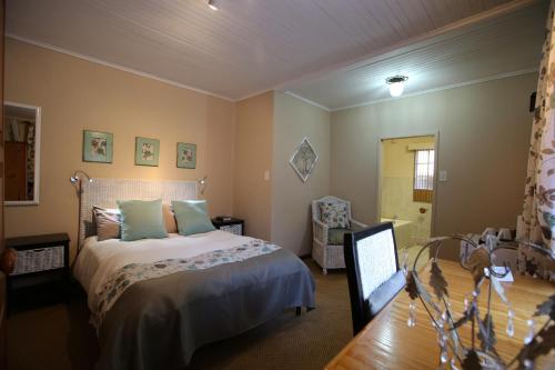 a bedroom with a bed and a mirror in it at Big Tree Midrand in Midrand