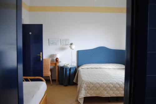 Postel nebo postele na pokoji v ubytování Hotel Sette Archi