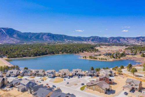 an aerial view of a town with a lake at Large Brand-New Home Close to Lake & Mountains in Monument
