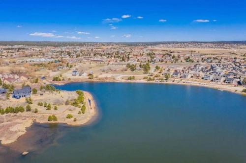 an aerial view of a lake with houses at Large Brand-New Home Close to Lake & Mountains in Monument