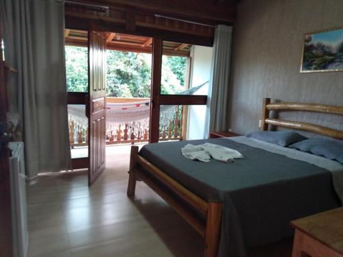 Łóżko lub łóżka w pokoju w obiekcie Pousada Pantanal da Serra