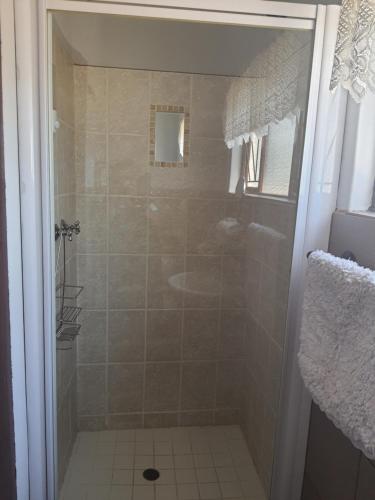 a bathroom with a shower and a sink at Flight Inn in Margate