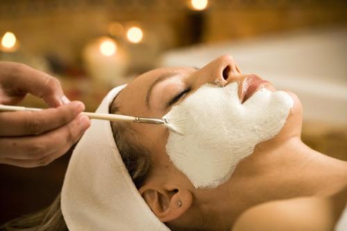 a woman getting her face treated with a cosmetic mask at Cabo Surf Hotel in San José del Cabo
