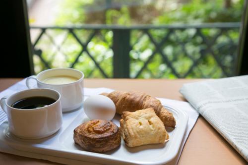 a plate of pastries and a cup of coffee on a table at Washington R&B Hotel Higashi Nihonbashi in Tokyo