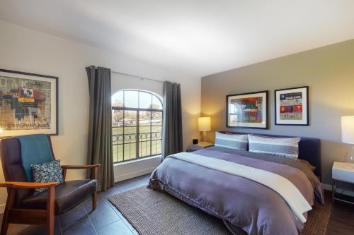 a bedroom with a large bed and a window at Desert Sunset Serenity in Phoenix