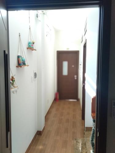 a hallway of an office with a door and a hallway at Homestay Halley in Da Nang
