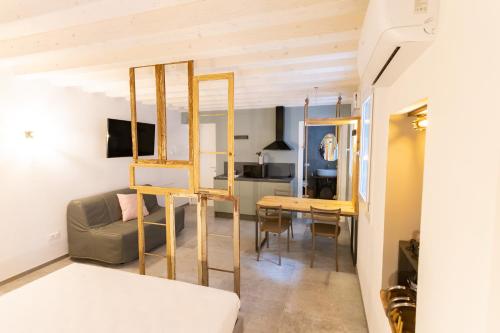 a living room with a loft bed and a table at Casa San Cristoforo in Chioggia