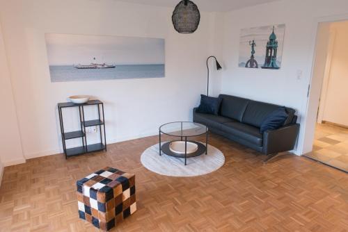 a living room with a couch and a table at Gästehaus Albero in Lindau