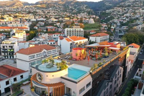 an aerial view of a city with buildings at Three House Hotel in Funchal