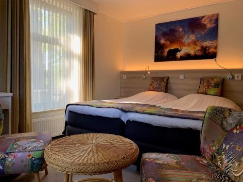 Säng eller sängar i ett rum på Hotel Handelia