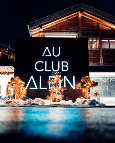 a sign that says au club alpn in front of a building at Au Club Alpin in Champex
