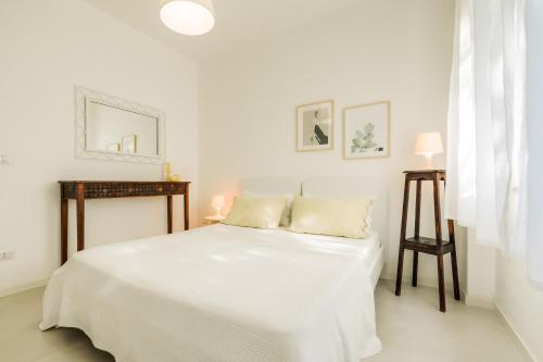 Postel nebo postele na pokoji v ubytování Magnolia - Civico 96