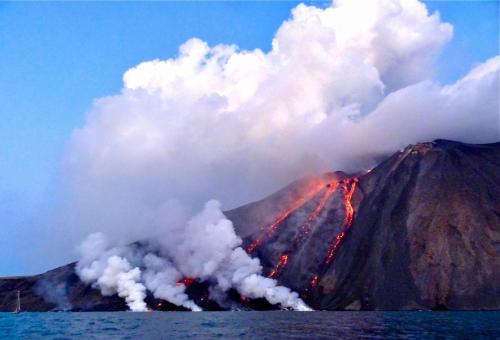 a volcano with a lot of smoke and lava at La Casa di Nonna Ida in Stromboli
