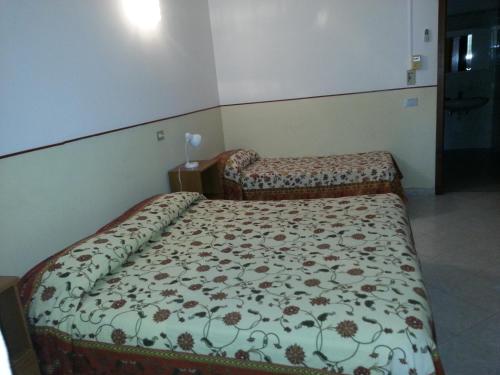 Cama o camas de una habitación en Albergo Ristorante Lucciola