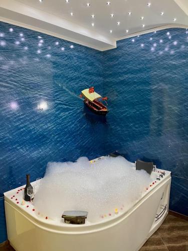 a small boat in the water in a room at Villa Maki in Ohrid
