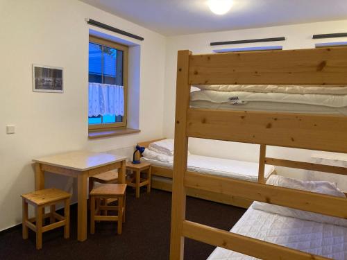 Postel nebo postele na pokoji v ubytování Apartmány Prášily