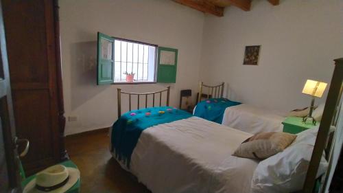 Кровать или кровати в номере Los Arcabuceros Casa Hotel Boutique