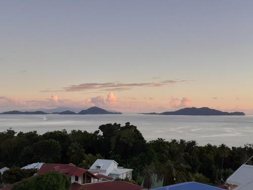 a view of the ocean with mountains in the distance at Gites Kas'a Flo in Trois-Rivières