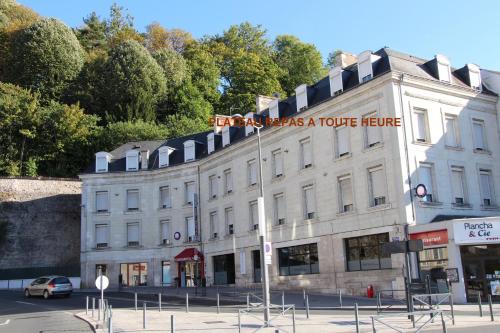 a building with a sign on the side of it at The Originals City, Hôtel Continental, Poitiers in Poitiers
