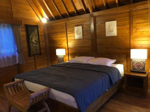 Ένα ή περισσότερα κρεβάτια σε δωμάτιο στο BUYAN LODGE lake view villa