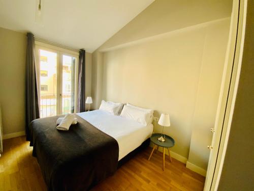 Ένα ή περισσότερα κρεβάτια σε δωμάτιο στο Apartaments Santa Clara – Baltack Homes
