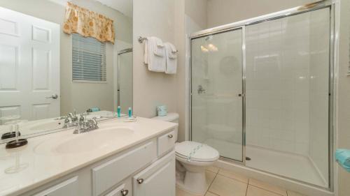 a bathroom with a shower and a sink and a toilet at Luxury Contemporary Style Villa on Windsor Hills Resort, Orlando Villa 4812 in Orlando