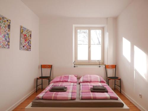 En eller flere senge i et værelse på Apartment Zweite Heimat Freiburg