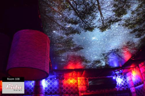 a view of the night sky from a building with lights at Lida Hotel in Athens