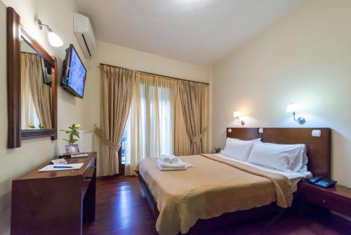 Una cama o camas en una habitación de Akroyali Hotel & Villas