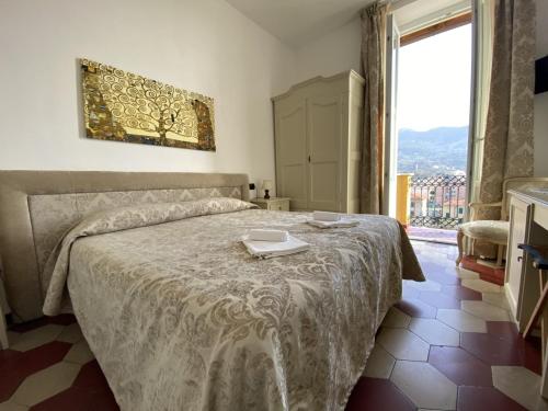 a bedroom with a bed with a tray on it at Villa Margherita in Levanto