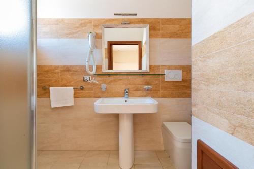 Et badeværelse på Lido Marini Rooms