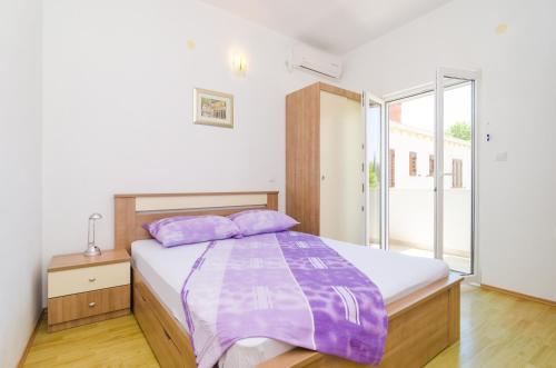 Ένα ή περισσότερα κρεβάτια σε δωμάτιο στο Rooms & Apartments Barišić